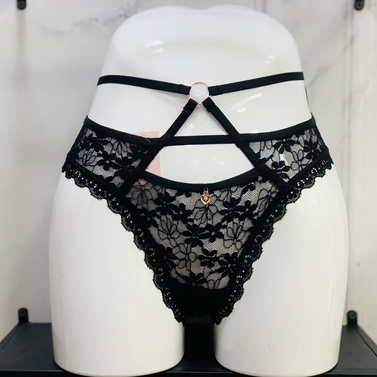 Last Call lace thong in Black, front view on model